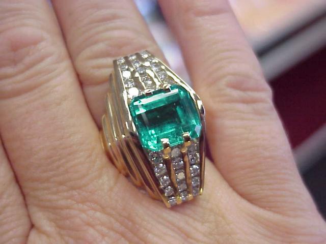 6ct. Emeral Ring with a waterfall style diamonds